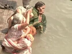 Women bathing on the Ganges river Stock Footage