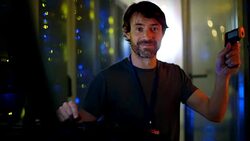 Portrait smiling server room technician pointing laser pointer Stock Footage