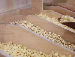 Customer purchases pistachios in grocery Stock Footage