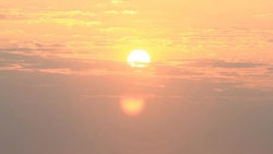 Sunrise through flowing cloud waves, mountain Stock Footage