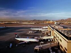 WS  T/L ZI Passenger planes connected to gangways at their gates at airport terminal / Phoenik, Arizona, USA   Stock Footage