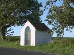 WS View of little chapel on field / KÃƒÂ¶rrig, Saargau, Rhineland-Palatinate, Germany Stock Footage