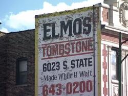 Elmo's Tombstone advert on side of building News Clip