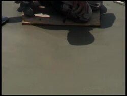 Construction: Smoothing Wet Cement / Concrete from Platform Stock Footage