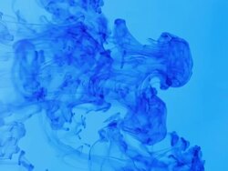 Blue Dye in Water Falling and Swirling Background Stock Footage