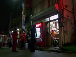 WS Group of young trendily dressed people talking, laughing, having fun around small restaurant / Tokyo, Japan Stock Footage