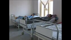 Wounded Afghans in hospital beds News Clip