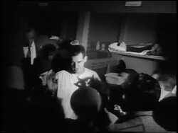 B/W 1956 New York Yankee Don Larsen being interviewed in locker room after pitching a 'perfect game' in Game 5 of the World Series Stock Footage