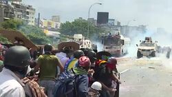 CLEAN : Riot police fire tear gas at mob to break up anti-Maduro protest News Clip