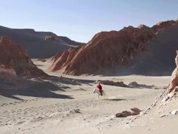 MS TS Man riding through sandy valley on horseback / Angostura, Chile Stock Footage