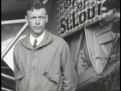 Aviator Charles Lindbergh stands with his airplane, the Spirit of St Louis. News Clip