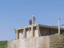 WS Workers at deconstruction of bridge over river Mosel / Wellen, Rhineland Palatinate, Germany Stock Footage