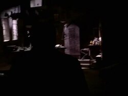 A priest checks a man on a floor for signs of life. Stock Footage