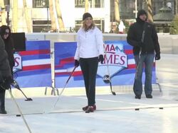 Lara Spencer takes some practice hockey goal shots at the Ice Rink in Bryant Park Stock Footage