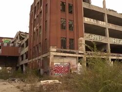 Pan of abandoned auto assembly plant Stock Footage