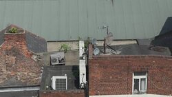 air conditioning maintenance engineer man extreme city location working on rooftop working fixing unit Stock Footage