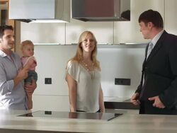 HD: Realtor Showing The Kitchen To A Family Stock Footage