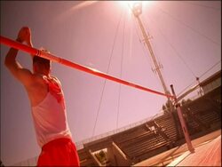 MS man jumping over high jump, bar falling, Australia Stock Footage