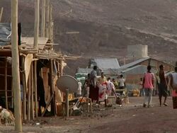People walking through village Stock Footage