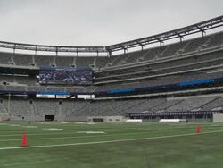 Shot from on the field at MetLife Stadium in East Rutherford, New Jersey. Shot pans across the interior of the stadium revealing empty seats Stock Footage