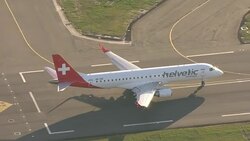 Aerials of a Helvetic plane taking off News Clip