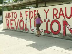 MS Shot of Woman walking by street / Havana, Cuba  Stock Footage