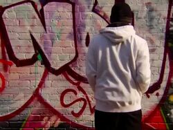 Wide Shot of Graffiti Artist Painting Urban Wall Stock Footage