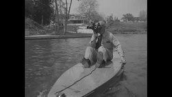 Man shoots film from moving Motorboard in a demonstration of a motorized surfboard designed by Joe Gilpin 1948 News Clip
