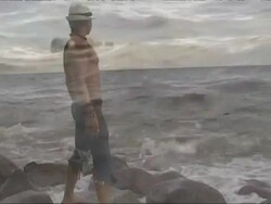 Castaway throwing SOS message in a bottle from island Stock Footage