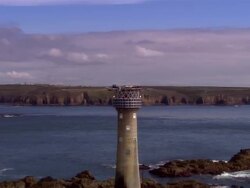 CU, ZO, LOW AERIAL, Lighthouse, Longships, Land's End, Cornwall, England Stock Footage