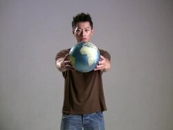 (HD1080i) Asian Man Offers World Stock Footage