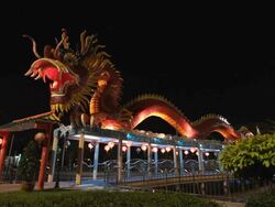 Red dragon statue in the park. Stock Footage