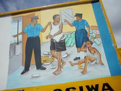 ECU Shot of sign says" Rape is punishable in Sierra Leone" / Freetown, Sierra Leone Stock Footage