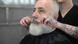 brutal barber clipper mows bearded adult senior hipster Stock Footage