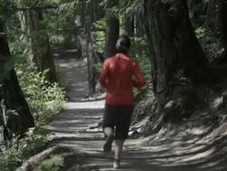 women running on trail from behind Stock Footage
