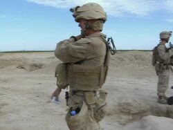 February 2009 MS PAN View of soldiers standing in landscape / Bakwa, Farah Province, Afghanistan Stock Footage