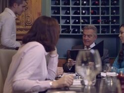 MS PAN Businesswoman paying bill through credit card reader in restaurant Stock Footage
