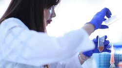 Scientist transferring solutions to new tube, Slow motion Stock Footage