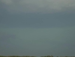 WS View of lightning strike ground behind cloud over prairie in day / Texas, United States Stock Footage