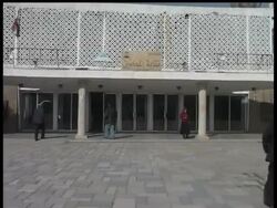 The trial has been postponed for the Iraqi journalist who threw his shoes at President George W. Bush. Iraq's judicial council is awaiting a court ruling on whether the man should be charged with assaulting a foreign leader or insulting one. News Clip