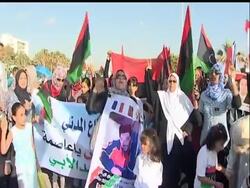 Thousands of demonstrators marched through Benghazi on Saturday, in a show of unity against Libyan leader Moammar Gadhafi.   Elsewhere, Libyan rebels battled their way back into a major oil port just 30 miles west of Tripoli. News Clip