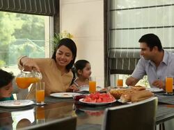 Family eating breakfast in a dining room  Stock Footage