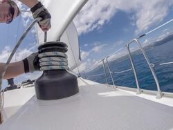 MS Man Wrapping A Rope Around Winch Stock Footage