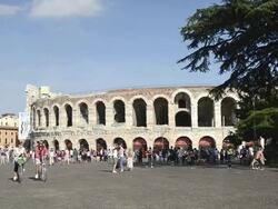 MS Shot of Tourists roaming in front of Arena di Verona at Piazza Bra / Verona, Veneto, Italy Stock Footage