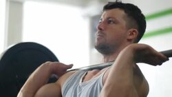 Strong man lifting weights Stock Footage