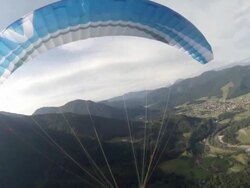 A young man paragliding over a European landscape. - filmed in Munich, Germany, Europe Stock Footage
