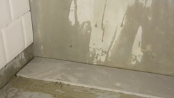 laying ceramic wood tiles on floor, installing tiles in construction site. Stock Footage