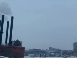 MS PAN Smoke stacking by Mississippi river in Minneapolis / Minneapolis, Minnesota, United States Stock Footage