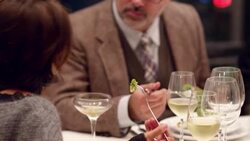 MS Man and woman in discussion during dinner party Stock Footage