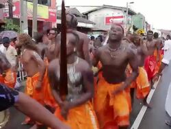 MS PAN TU TD View of Seenigama annual Perahera parade in dancers and musicians taking part in traditional Buddhist procession AUDIO / Sinigama, Southern Province, Sri Lanka Stock Footage